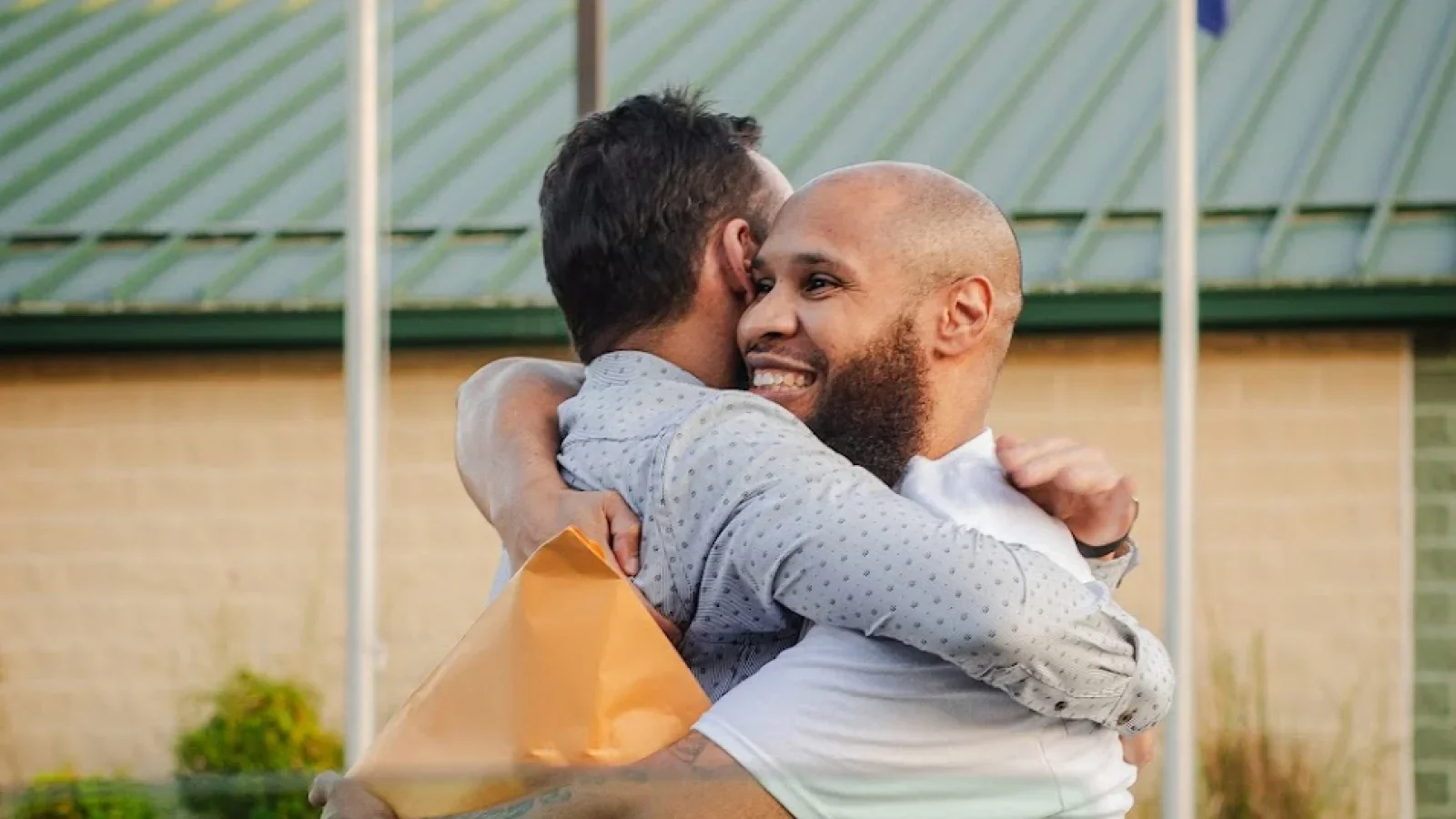 Edward Martinez embracing Marc Howard when he is released